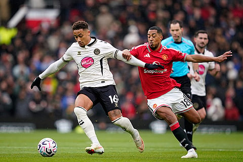 Bournemouth's Marcus Tavernier, left, and Manchester United's Youri Tielemans challenge for the ball during the English Premier League soccer match between Manchester United and Bournemouth in Manchester, England, Sunday, Oct. 25, 2026.