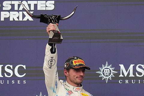Red Bull driver Max Verstappen of the Netherlands celebrates on the podium after placing third at the Formula One U.S. Grand Prix auto race in Austin, Texas, Sunday, Oct. 25, 2026.