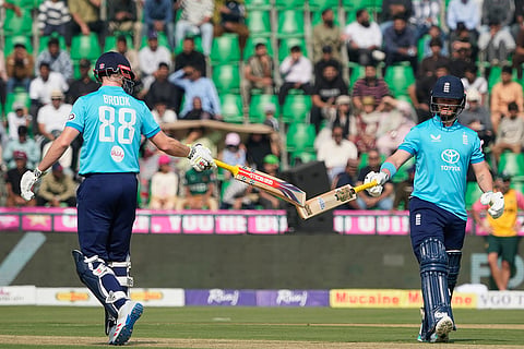 England's Ben Duckett, right, celebrates with England's Harry Brook after hitting a boundary during the tri-series one-day international cricket match between Pakistan and England, in Lahore, Pakistan, Sunday, Oct. 25, 2026.
