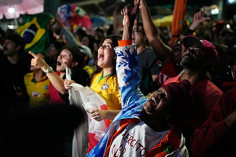 Supporters of President Luiz Inacio Lula da Silva, who is seeking reelection, cheer as presidential runoff results are announced in Sao Paulo, Sunday, Oct. 25, 2026.