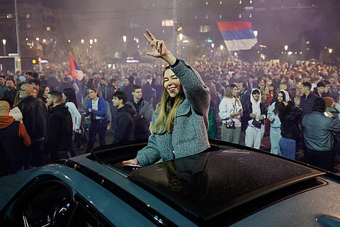 People celebrate after Aleksandar Vucic, leader of the right-wing Serbian Progressive Party (SNS) conceded defeat in the parliamentary election in Belgrade, Serbia, Sunday, Oct. 25, 2026.