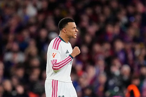 Real Madrid's Kylian Mbappe celebrates after scoring his side's second goal during a Spanish La Liga soccer match between FC Barcelona and Real Madrid in Barcelona, Spain, Sunday, Oct. 25, 2026.