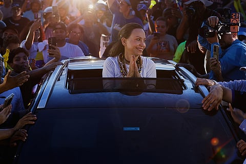Supporters surround Venezuelan opposition leader and Nobel Peace Prize laureate Maria Corina Machado in Valencia, Venezuela, following her return to the country after months abroad, Sunday, Oct. 25, 2026.