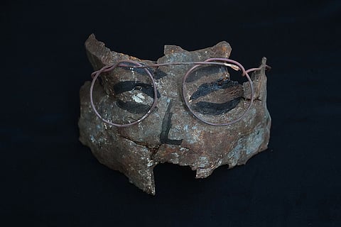 An artwork depicting a face wearing glasses, created by visual artist Lina Jouni from shrapnel collected from Israeli military munitions, is displayed at her home in the village of Roumin, southern Lebanon, Sunday, Oct. 25, 2026.