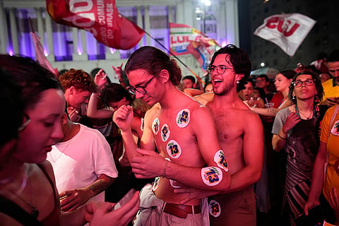 Supporters of President Luiz Inacio Lula da Silva celebrate after he wins a fourth term in the presidential runoff in Rio de Janeiro, Brazil, Sunday, Oct. 25, 2026.