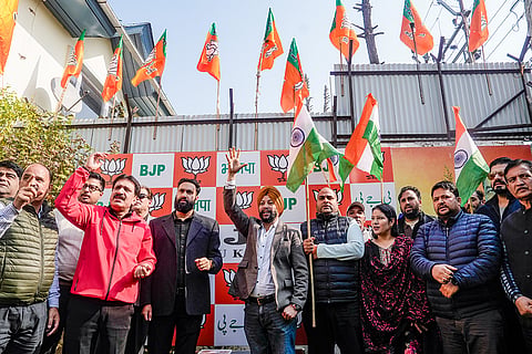 BJP workers and supporters during Accession Day celebrations at party office, in Srinagar.