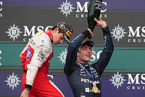 Mercedes driver Andrea Kimi Antonelli of Italy, right, celebrates on the podium after winning the Formula One U.S. Grand Prix auto race in Austin, Texas, Sunday, Oct. 25, 2026.