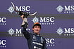| Photo: AP/Eric Gay : Mercedes driver Andrea Kimi Antonelli of Italy celebrates on the podium after winning the Formula One U.S. Grand Prix auto race in Austin, Texas, Sunday, Oct. 25, 2026.