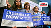 California’s Billionaire Tax Explained: The Money, The Risks And The Legal Battle | Photo: Frederic J Brown/AFP : Healthcare workers and supporters of California's Proposition 40 hold campaign placards during a media briefing in Los Angeles on April 27, 2026.