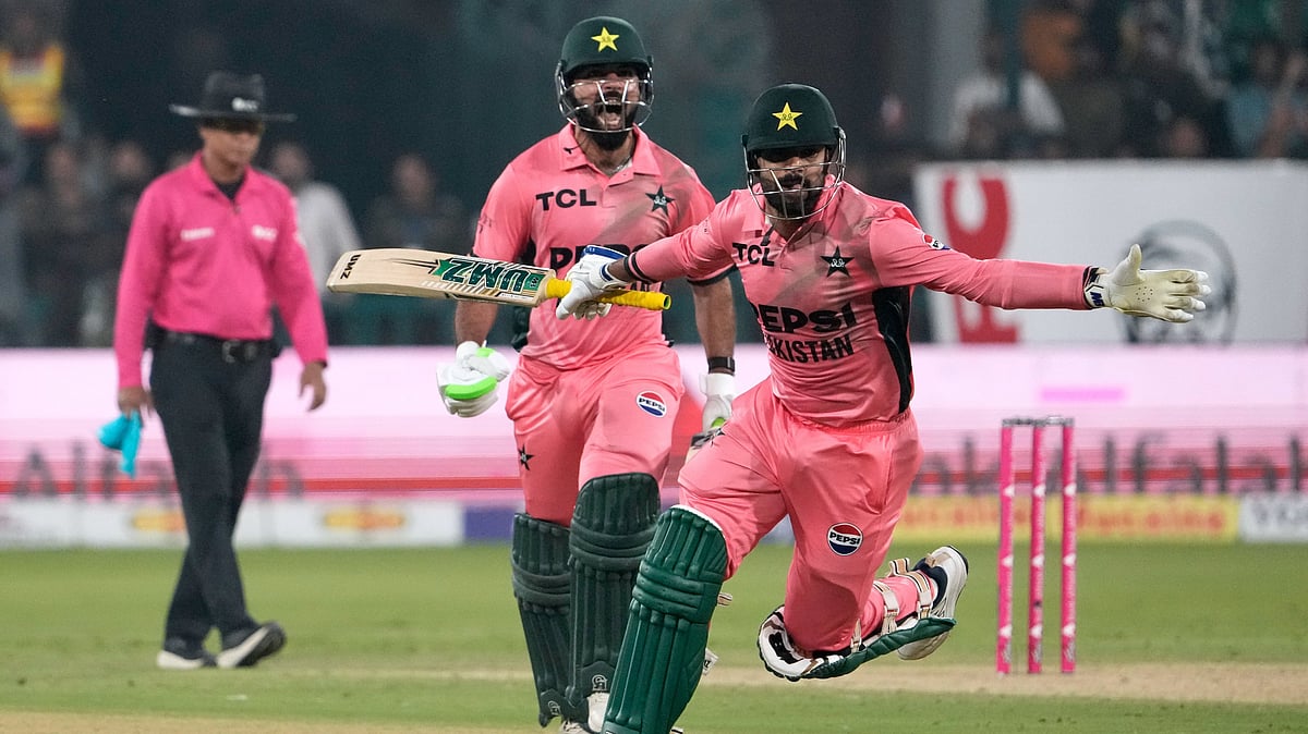 Pakistan's Shadab Khan and Haris Rauf celebrate after winning the tri-series one-day international cricket match against England, in Lahore, Pakistan, Sunday, Oct. 25, 2026 - (AP Photo/K.M. Chaudary)