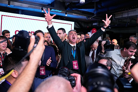 Students' List leader Ilija Srdanovic celebrates after Aleksandar Vucic, leader of the right-wing Serbian Progressive Party (SNS) conceded defeat in the parliamentary election in Belgrade, Serbia, Sunday, Oct. 25, 2026.