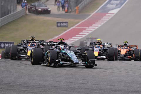 Mercedes driver Andrea Kimi Antonelli of Italy, center, leads the field after the start of the Formula One U.S. Grand Prix auto race in Austin, Texas, Sunday, Oct. 25, 2026.