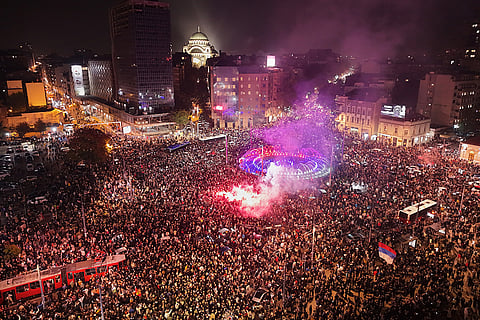 People celebrate after Aleksandar Vucic, leader of the right-wing Serbian Progressive Party (SNS) conceded defeat in the parliamentary election in Belgrade, Serbia, Sunday, Oct. 25, 2026.