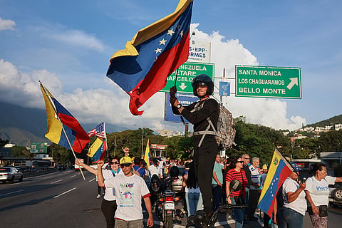 Supporters of Venezuelan opposition leader and Nobel Peace Prize laureate Maria Corina Machado celebrate her return to Venezuela after months abroad in Caracas, Venezuela, Sunday, Oct. 25, 2026.