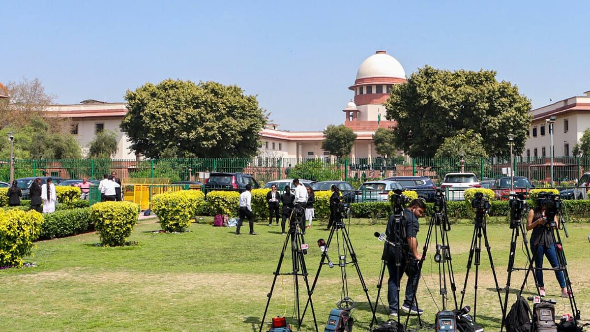 Journalists and camera crews gather outside the Supreme Court of India in New Delhi. The court is due to hear a challenge by 21 news publishers to provisions of the Digital Personal Data Protection Act. -  | Photo: PTI