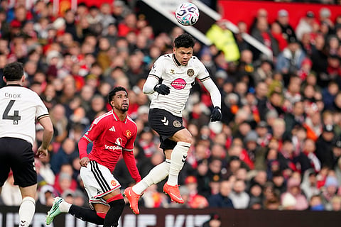 Manchester United's Andrey Santos, left, and Bournemouth's Evanilson challenge for the ball during the English Premier League soccer match between Manchester United and Bournemouth in Manchester, England, Sunday, Oct. 25, 2026.