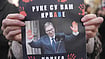 AP : Protestor Holding Banner Against Aleksandar Vučić