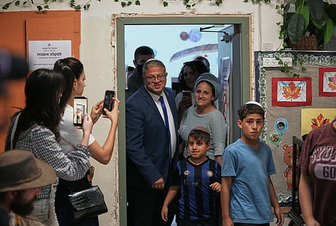 National Security Minister Itamar Ben Gvir, head of the Otzma Yehudit party, arrives with his family to vote during Israel's general elections in the settlement of Kiryat Arba, in the occupied West Bank, Tuesday, Oct. 27, 2026. 
