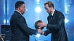 Harry Kane Wins 2026 Ballon d'Or, Ends England's 25-Year Wait For Football's Biggest Honour (AP Photo/Kin Cheung) : England's soccer player Harry Kane receives the player of the year trophy from Ronaldo Nazario during the Ballon d'Or ceremony at the London Palladium Theatre in London, England, Monday, Oct. 26, 2026