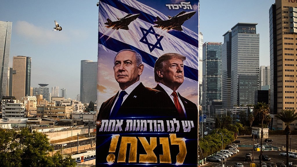 Likud Party campaign billboard featuring US President Donald Trump and Israeli Prime Minister Benjamin Netanyahu, with a Hebrew message reading, "We have one opportunity to win," in Tel Aviv - AP Photo/Oded Balilty