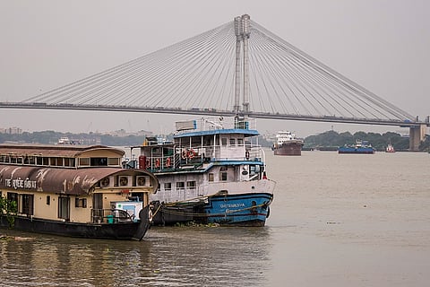 Boats moored along the banks of the Hooghly river as a precautionary measure ahead of the impending landfall of cyclonic storm 'Arnab' near Visakhapatnam, in Kolkata, West Bengal, Tuesday, Oct. 27, 2026.