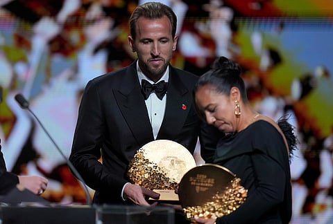 England's soccer player Harry Kane and Charlyn Corral win strikers of the year during the Ballon d'Or ceremony at the London Palladium Theatre in London, England, Monday, Oct. 26, 2026.