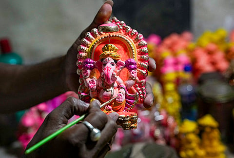 An artisan paints on an idol of Lord Ganesh ahead of the ‘Diwali’ festival, in Kolkata, Sunday, Oct. 25, 2026. 
