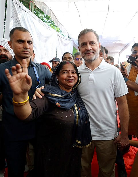 Leader of Opposition in the Lok Sabha Rahul Gandhi interacts with local residents during a 'Jansunwai' programme on the Special Intensive Revision (SIR) of electoral rolls, at Trilokpuri, in New Delhi. 