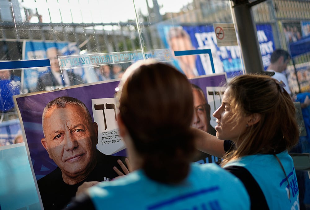 Yashar party campaign poster featuring Gadi Eisenkot outside a polling station