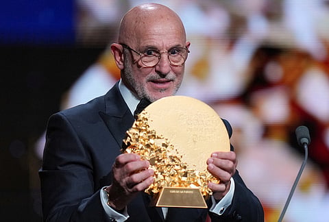 Luis de la Fuente of Spain receives the trophy for winning the 2026 Men's Coach of the Year during the Ballon d'Or ceremony at the London Palladium Theatre in London, England, Monday, Oct. 26, 2026.