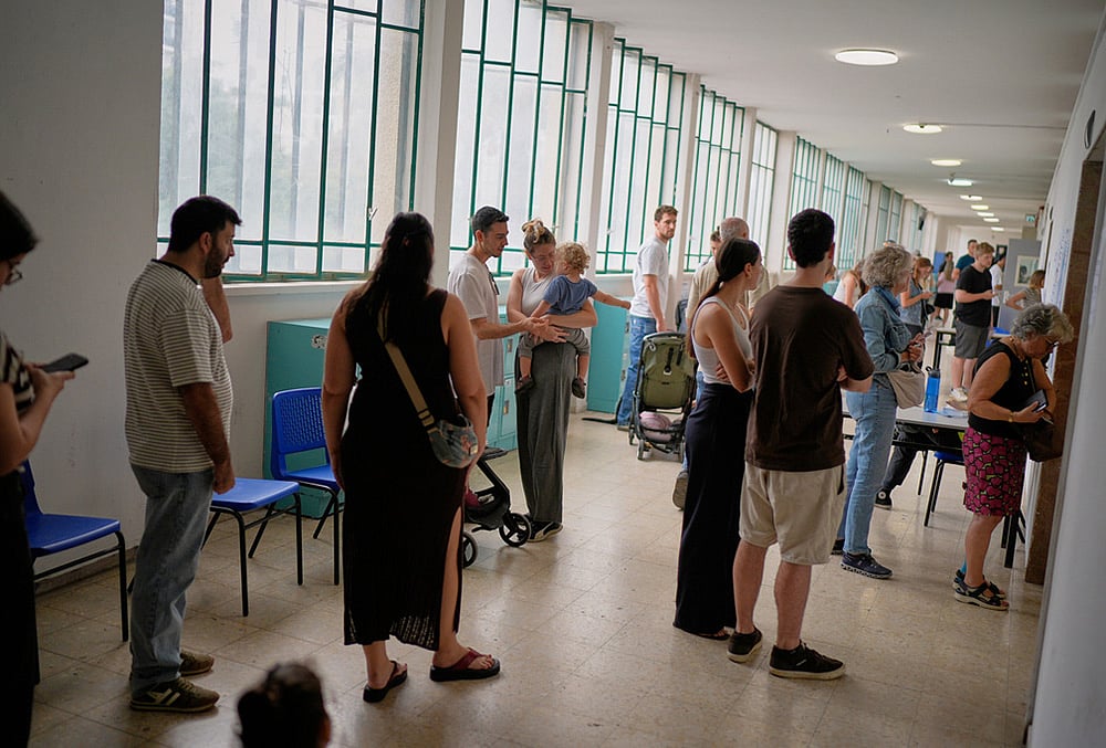 Voters wait in line to cast their ballots in israel