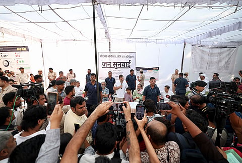 Leader of Opposition in the Lok Sabha Rahul Gandhi interacts with local residents during a 'Jansunwai' programme on the Special Intensive Revision (SIR) of electoral rolls, at Trilokpuri, in New Delhi. 
