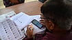 IMAGO/ZUMA Press Wire : A Booth Level Officer (BLO) Re-verifying the voter card during the Special Revision (SR) of the electoral roll