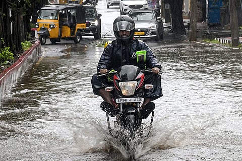 A motorcyclist wades through a waterlogged road amidst heavy rain ahead of cyclonic storm 'Arnab', in Visakhapatnam, Andhra Pradesh, Tuesday, Oct. 27, 2026.