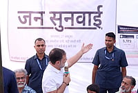 | Photo: AICC via PTI : Leader of Opposition in the Lok Sabha Rahul Gandhi interacts with local residents during a 'Jansunwai' programme on the Special Intensive Revision (SIR) of electoral rolls, at Trilokpuri, in New Delhi. 