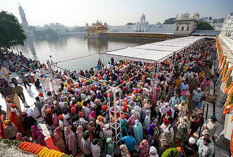 People gather at the Golden Temple to pay obeisance on the birth anniversary of Guru Ram Das, the fourth Sikh Guru, in Amritsar, Punjab, Tuesday, Oct. 27, 2026. 
