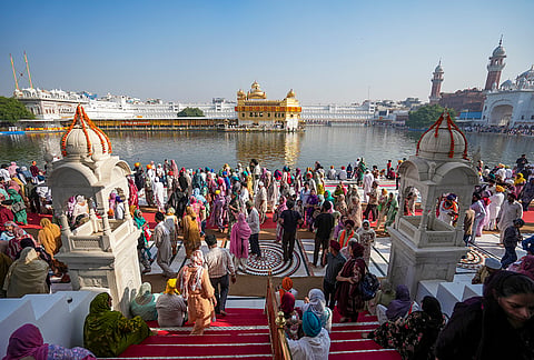 People gather at the Golden Temple to pay obeisance on the birth anniversary of Guru Ram Das, the fourth Sikh Guru, in Amritsar, Punjab, Tuesday, Oct. 27, 2026. 

