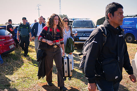 Passengers rescued from one of the trains involved in a collision arrive at a safe location in Urda, Spain, Wednesday, Oct. 28, 2026.