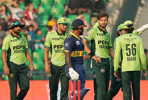 Pakistan's Shaheen Shah Afridi, second from right, celebrates with teammates after the dismissal of Sri Lanka's Avishka Fernando during the tri-series one-day international cricket match between Pakistan and Sri Lanka, in Lahore, Pakistan, Tuesday, Oct. 27, 2026. 
