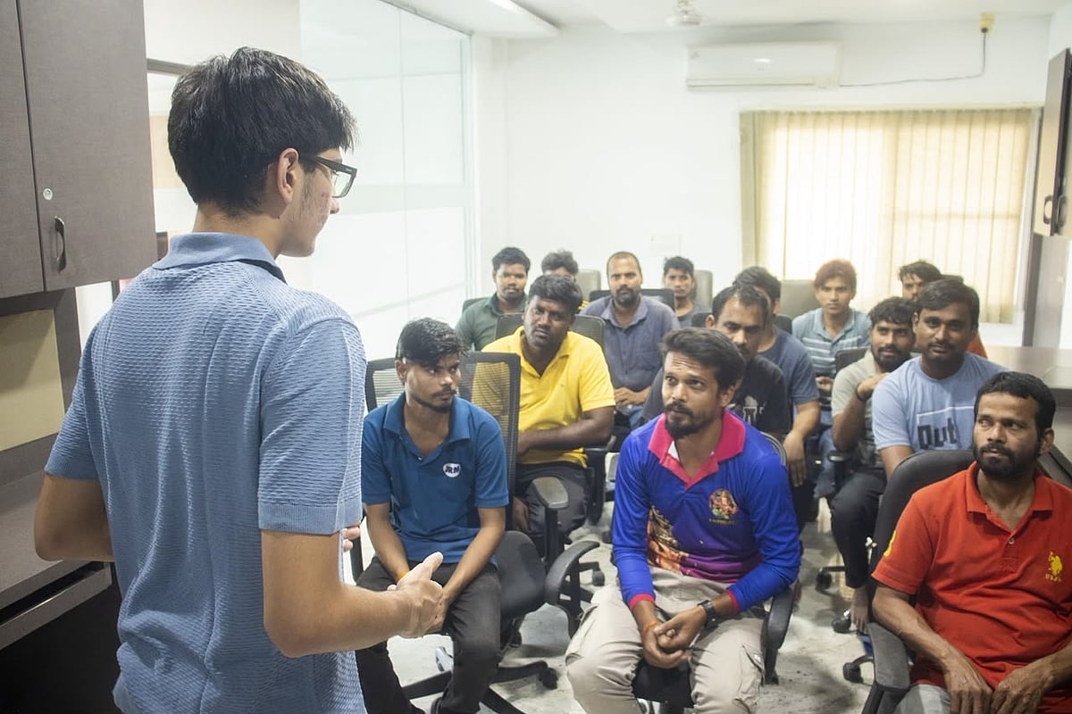 People attending a training session in a meeting room.