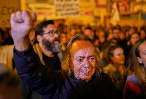 Protesters gather and shout slogans during a demonstration demanding affordable housing outside Portugal's Parliament in Lisbon, Tuesday, Oct. 27, 2026. 
