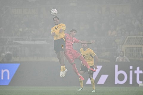 Dortmund's Felix Nmecha, left, and Bremen's Chuki challenge for the ball during the German soccer cup match between Borussia Dortmund and Werder Bremen in Dortmund, Germany, Tuesday, Oct. 27, 2026.