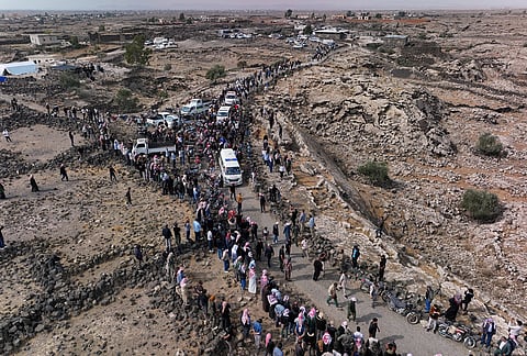Mourners join the funeral procession for five family members, including three children, killed in a Jordanian airstrike in Al-Tuff in southern Syria's Daraa province, Tuesday, Oct. 27, 2026, following attacks Jordan said targeted Islamic State militants and acknowledged also killed civilians. 