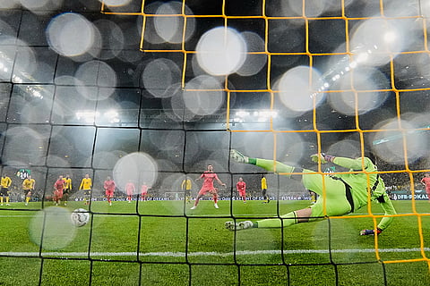 Bremen's Niclas Fuellkrug scores a penalty against Dortmund's goalkeeper Gregor Kobel during the German soccer cup match between Borussia Dortmund and Werder Bremen in Dortmund, Germany, Tuesday, Oct. 27, 2026.
