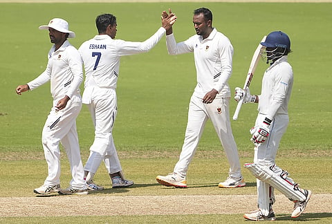 Railways' Toufik Uddin Mondal celebrates with teammates after taking the wicket of Tamil Nadu's Narayan Jagadeesan on day 3 of a Ranji Trophy Elite Group D cricket match between Tamil Nadu and Railways, in Chennai.