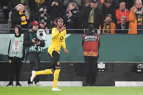 Dortmund's Carney Chukwuemeka celebrates after scoring a goal during the German soccer cup match between Borussia Dortmund and Werder Bremen in Dortmund, Germany, Tuesday, Oct. 27, 2026.