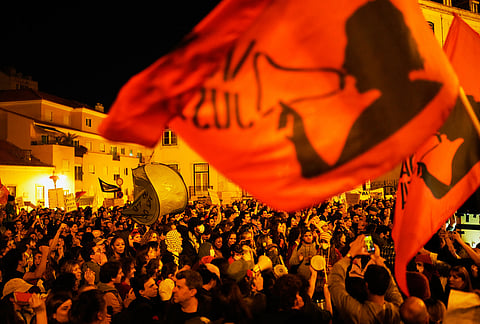 Protesters take part in a demonstration demanding affordable housing outside Portugal's Parliament in Lisbon, Tuesday, Oct. 27, 2026. 
