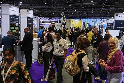 Visitors walk past exhibition stands at the Dubai AI Festival in Dubai, United Arab Emirates, Tuesday, Oct. 27, 2026.