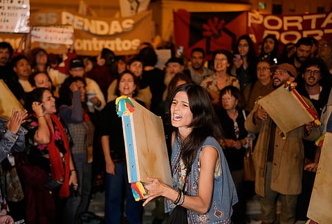 Protesters gather and shout slogans during a demonstration demanding affordable housing outside Portugal's Parliament in Lisbon, Tuesday, Oct. 27, 2026. 
