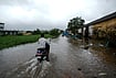 | Photo: AP/Mahesh Kumar A. : Motorists navigate floodwaters at Kakinada, as Cyclone Arnab crossed the Andhra Pradesh coast in the early hours of Wednesday, Oct. 28, 2026. 